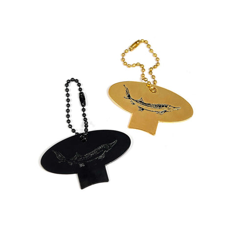 Side with sturgeon engraving, reverse side has Caviar Star logo engraving.