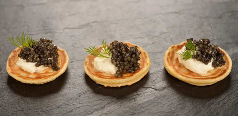 caviar on top of blinis