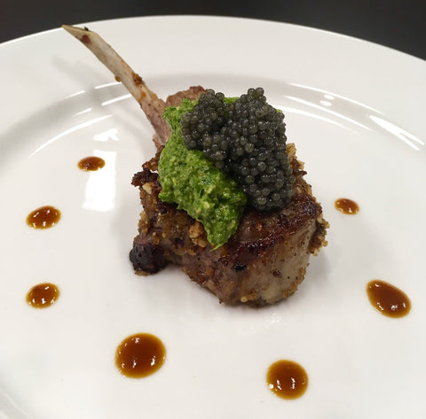 Lamb chop topped with Arugula Pesto and American Paddlefish Caviar