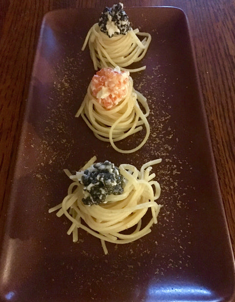 Pasta Spirals topped with Caviar Butter on a plate
